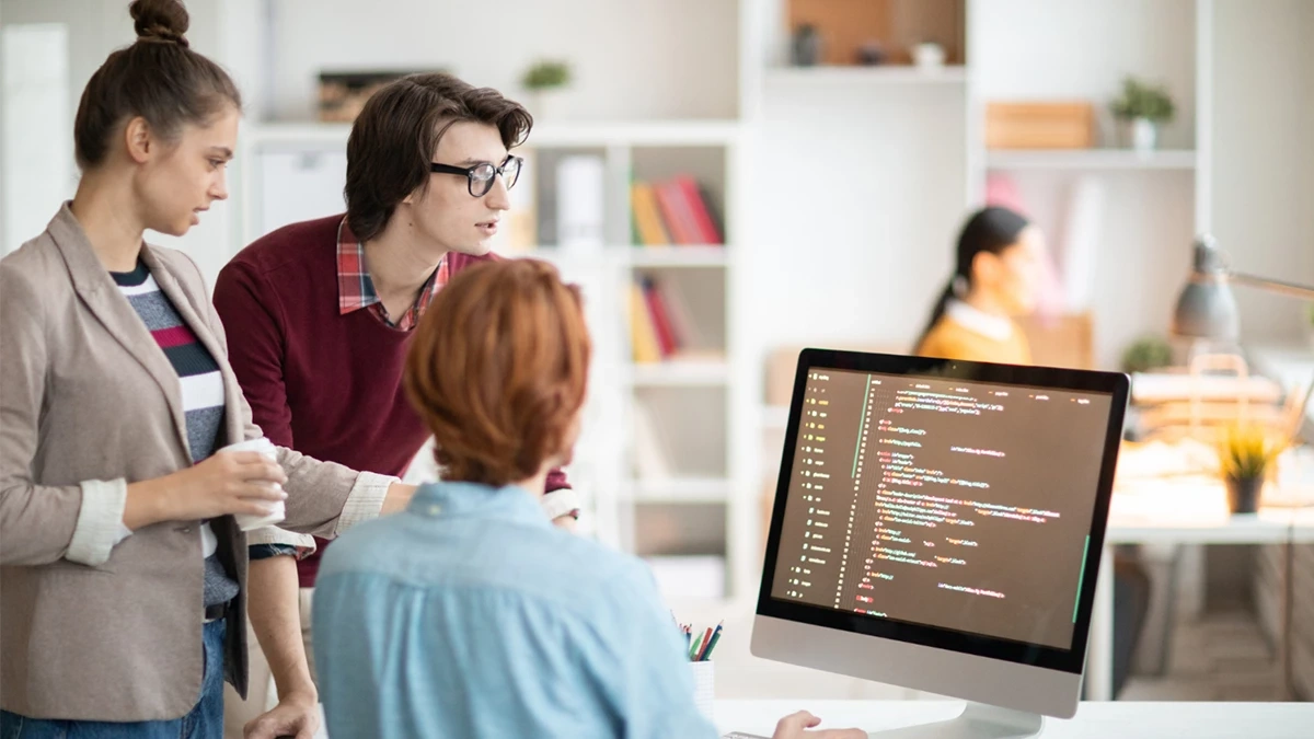 A team of web developers collaborating on code on a computer screen, representing expertise in the best website development company in Chicago.